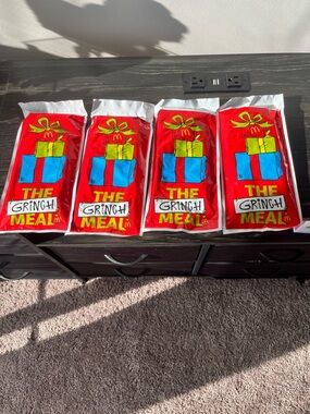 McDonald's Red Grinch Meal Promotional Bags with Blue and Yellow Gifts